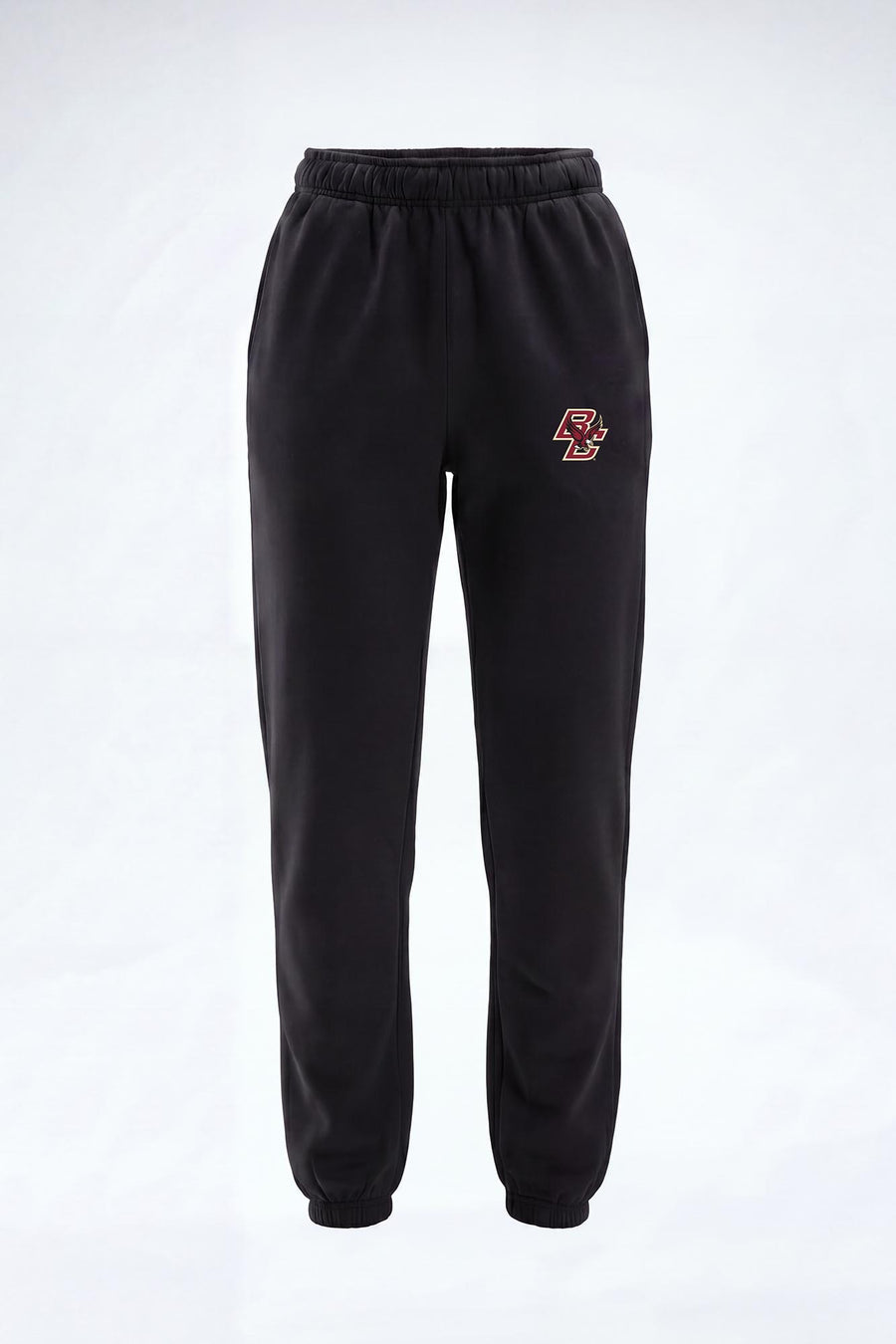 Black sweatpants with an elastic waistband and cuffs, featuring a small orange and white crest logo on the left chest, displayed against a light gray background.