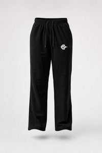 Black sweatpants with an elastic waistband, drawstring, and a small white embroidered logo on the left thigh, shown against a light gray background.
