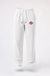 White sweatpants with an elastic waistband and drawstring, featuring a small red and black graphic logo on the left thigh, shown against a light gray background.