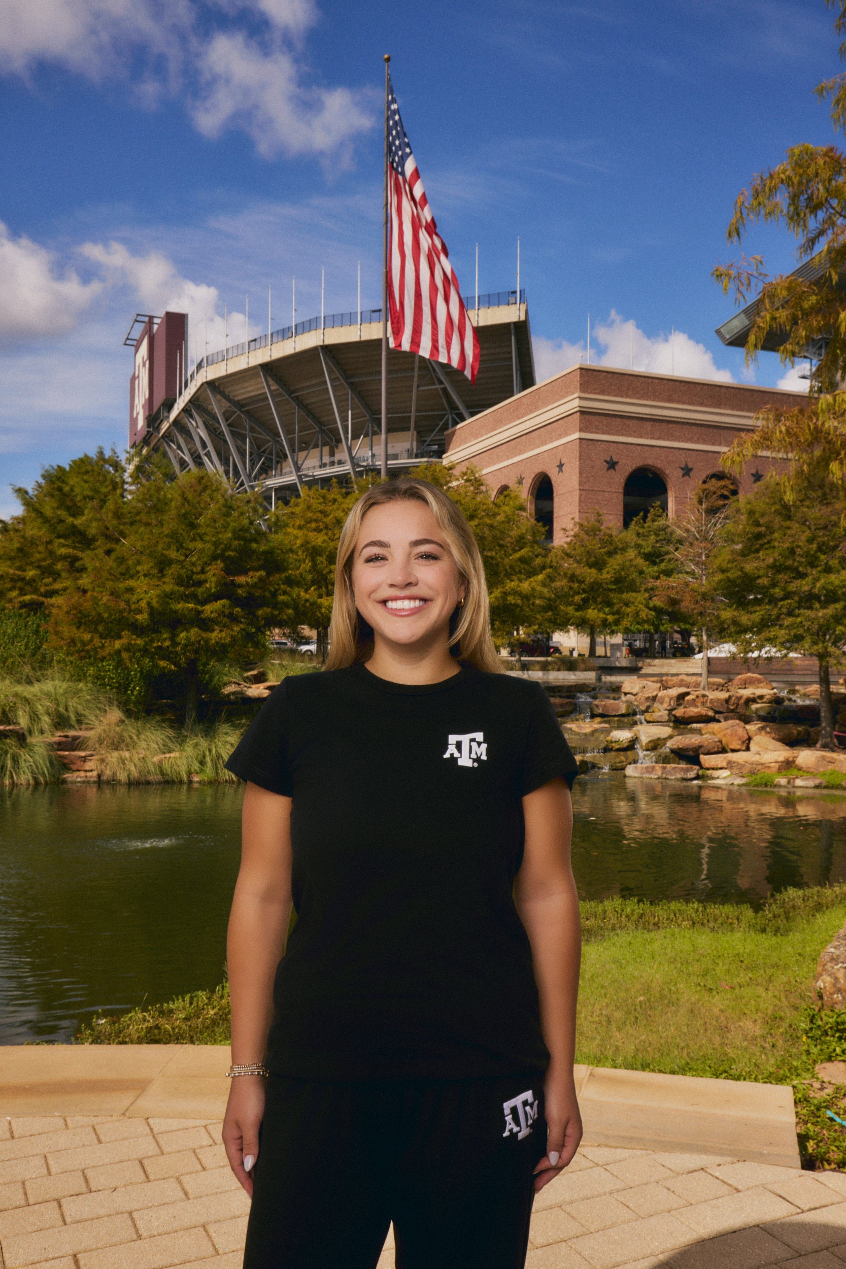 young woman wear texas A&M black tee and sweatpants set from AVO