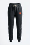 Black sweatpants with a logo on a light gray background