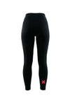 Black high-waisted leggings with a small red letter logo on the lower left leg, shown on a plain white background.