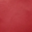 A close-up of a solid red textured surface, likely a fabric or material swatch.
